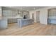 Modern kitchen with gray cabinets, island, and stainless steel appliances at 63 Homesite Cooper W Cv, Fayetteville, GA 30214