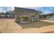 Two-story house with backyard patio and grassy yard at 63 Homesite Cooper W Cv, Fayetteville, GA 30214