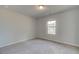 Bright bedroom with neutral carpeting and large window at 63 Homesite Cooper W Cv, Fayetteville, GA 30214