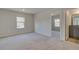 Bright bedroom with neutral carpeting and access to a private bathroom at 63 Homesite Cooper W Cv, Fayetteville, GA 30214