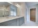 Spa-like bathroom featuring double sinks, a large mirror, and a walk-in shower at 63 Homesite Cooper W Cv, Fayetteville, GA 30214