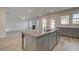 Spacious kitchen island with double sink and views into the Gathering room at 63 Homesite Cooper W Cv, Fayetteville, GA 30214