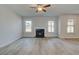 Spacious living room with hardwood floors and a gas fireplace at 63 Homesite Cooper W Cv, Fayetteville, GA 30214