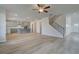 Open living area with hardwood floors and kitchen views at 63 Homesite Cooper W Cv, Fayetteville, GA 30214