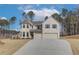 Two story home with a three car garage and landscaped yard at 63 Homesite Cooper W Cv, Fayetteville, GA 30214
