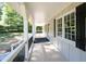 Spacious front porch with white railings, offering a relaxing outdoor space at 2690 Old Hickory Nw Dr, Marietta, GA 30064