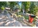 Home nestled on a hillside with a long driveway at 2953 Collier Nw Dr, Atlanta, GA 30318
