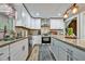 Newly renovated kitchen with white cabinets, granite countertops, and stainless steel appliances at 2953 Collier Nw Dr, Atlanta, GA 30318