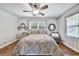 Well-lit bedroom featuring hardwood floors and a comfy bed at 2953 Collier Nw Dr, Atlanta, GA 30318