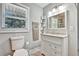 Clean bathroom with a white vanity and new tile at 2953 Collier Nw Dr, Atlanta, GA 30318