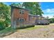 Brick house with a deck and carport, offering curb appeal at 2953 Collier Nw Dr, Atlanta, GA 30318