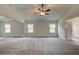 Large main bedroom with ceiling fan and carpet flooring, multiple access points at 604 Amabile Rd, Locust Grove, GA 30248