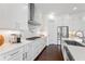 White kitchen with stainless steel appliances and quartz countertops at 3330 Carswell Bnd, Cumming, GA 30028