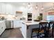 Modern kitchen with white cabinets, stainless steel appliances, and a large island at 4619 Spring St, Acworth, GA 30101