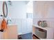 Stylish bathroom with white wainscoting, a pedestal sink, and a decorative shelf at 4619 Spring St, Acworth, GA 30101