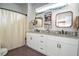 Main bathroom with double vanity, granite countertops, and a shower/tub combo at 4619 Spring St, Acworth, GA 30101