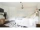 Main bedroom with a king-size bed, ample closet space, and a seating area at 4619 Spring St, Acworth, GA 30101