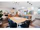 Open concept kitchen features an island, stainless steel appliances, and a large dining table at 4619 Spring St, Acworth, GA 30101