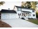 Two story home with white siding and two car garage at 4619 Spring St, Acworth, GA 30101