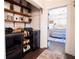 Laundry room with washer, dryer, shelving, and a view into a bedroom at 4619 Spring St, Acworth, GA 30101