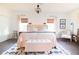 Main bedroom with a king-size bed, two nightstands, and a seating area at 4619 Spring St, Acworth, GA 30101