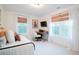 Bright bedroom with daybed, workstation and large windows at 4619 Spring St, Acworth, GA 30101