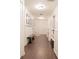 Long hallway with built-in shelving and dark hardwood floors at 4619 Spring St, Acworth, GA 30101