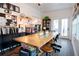 Bright craft room with a long farmhouse table and built-in shelving at 4619 Spring St, Acworth, GA 30101