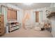 Bright Bedroom with crib, changing station and soft color palette at 4619 Spring St, Acworth, GA 30101