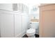 Small bathroom with white wainscoting and a toilet at 4619 Spring St, Acworth, GA 30101