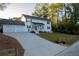 Two story white house with two car garage and driveway at 4619 Spring St, Acworth, GA 30101