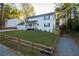 Two story white house with two car garage and long driveway at 4619 Spring St, Acworth, GA 30101
