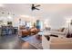 Open-concept living room and kitchen with hardwood floors and stylish furniture at 4619 Spring St, Acworth, GA 30101