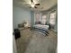 Spacious bedroom with bay window and gray carpet at 1958 Stonewood Dr, Lithia Springs, GA 30122