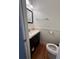 Clean bathroom with dark vanity, toilet and shower at 1958 Stonewood Dr, Lithia Springs, GA 30122