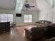 Spacious game room with hardwood and tile floors, wet bar, and comfortable seating at 1958 Stonewood Dr, Lithia Springs, GA 30122