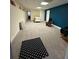 Finished basement with carpet, bed, and rocking chair at 1958 Stonewood Dr, Lithia Springs, GA 30122