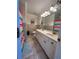 Bathroom with double vanity and colorful shower curtain at 1958 Stonewood Dr, Lithia Springs, GA 30122