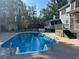 Inviting inground pool with a large patio area at 1958 Stonewood Dr, Lithia Springs, GA 30122