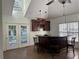 Home wet bar with dark wood cabinets and granite countertop at 1958 Stonewood Dr, Lithia Springs, GA 30122