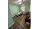 Light green bedroom with a twin bed and wood floors at 1958 Stonewood Dr, Lithia Springs, GA 30122