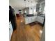Eat-in kitchen with hardwood floors and view to Gathering room at 1958 Stonewood Dr, Lithia Springs, GA 30122