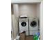 Laundry room with washer, dryer, and extra storage at 1958 Stonewood Dr, Lithia Springs, GA 30122