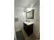 Basement bathroom vanity with mirror and storage at 1958 Stonewood Dr, Lithia Springs, GA 30122