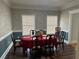 Formal dining room with dark wood table and chairs at 1958 Stonewood Dr, Lithia Springs, GA 30122
