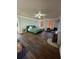 Main bedroom with teal bed and dark wood floors at 1958 Stonewood Dr, Lithia Springs, GA 30122