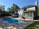 House with inground pool and screened porch at 1958 Stonewood Dr, Lithia Springs, GA 30122