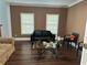 Sitting room with dark hardwood floors and brown walls at 1958 Stonewood Dr, Lithia Springs, GA 30122