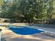 Relaxing inground pool surrounded by trees at 1958 Stonewood Dr, Lithia Springs, GA 30122
