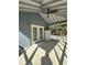 Screened porch with tile floor, ceiling fan, and French doors at 1958 Stonewood Dr, Lithia Springs, GA 30122